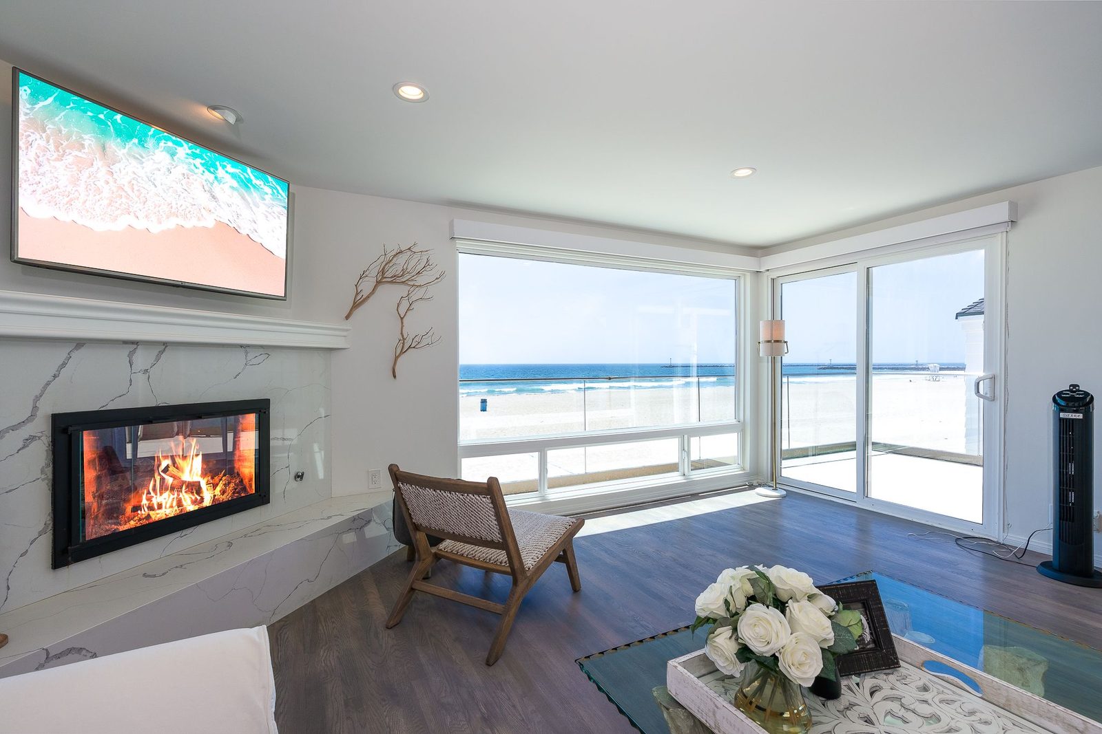 Third-floor sitting area with fireplace at sunset